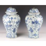 A pair of modern Chinese blue and white porcelain vases and covers, decorated with fish, height