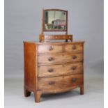 A late George III mahogany bowfront chest of two short and three graduated long drawers, on