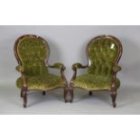 A pair of 20th century Victorian style stained beech showframe salon armchairs, upholstered in green