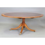 A late 20th century reproduction mahogany oval dining table by William Tillman, the top and base