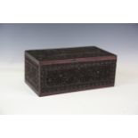 An Indian hardwood box and cover, profusely carved with foliage and flowers, width 37cm.Buyer’s