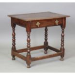 An early 18th century walnut side table, fitted with a single drawer, on ring turned legs, height