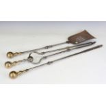 A set of three George III steel and brass handled fire tools, length of shovel 74.5cm.Buyer’s