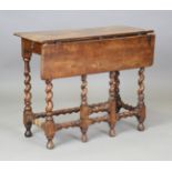 A Charles II walnut single drop-flap gateleg side table, fitted with two frieze drawers and raised