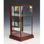 An Edwardian mahogany counter-top display case, inset with bevelled glass panels, height 52cm, width