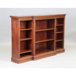 An Edwardian mahogany and line inlaid breakfront open bookcase, possibly by Edwards & Roberts,