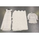 A collection of whitework and other textiles, including an infant's dress with panels of broderie