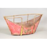 An early 20th century painted iron child's swing boat with raised handrail, length 130cm.Buyer’s