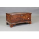 A 19th century provincial elm trunk, the hinged lid enclosing a candlebox, height 43cm, width