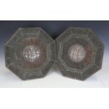 A pair of 19th century Indian copper and silver mounted chargers, each of octagonal form, the