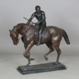 A large modern cast bronze equestrian figure, modelled as a jockey and his mount, on a