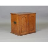 A mid-Victorian oak table-top collector's chest by Elkington & Co, the hinged lid above two doors