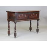 An early 18th century oak dresser base, fitted with two drawers, height 84cm, width 115cm, depth