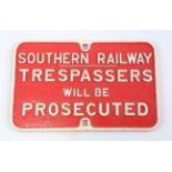 A Southern Railway cast iron 'Trespassers Will Be Prosecuted' sign, 40cm x 63cm.Buyer’s Premium 29.