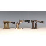 A group of three late 19th century brass and plated cartridge reloading tools, including a brass