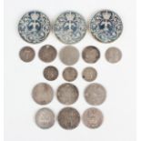 A group of British coins, including two Anne shillings, 1709 and 1711, a George I shilling 1720, a