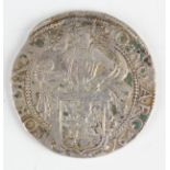 A Netherlands lion thaler 1676, obverse with knight supporting shield, reverse with rampant lion.