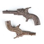 Two late 19th/early 20th century cast metal toy cap guns, one detailed 'Lion', length 13cm, the