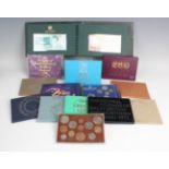 A large collection of Royal Mint and other commemorative coins, including various year sets, a