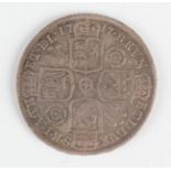 A George I half-crown 1717, reverse with roses and plumes to the angles of the shields, edge