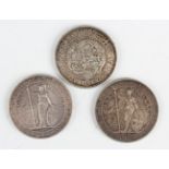Two Chinese British trade dollars, 1911 and 1929, and a Japanese one yen with heavy chopmarks to