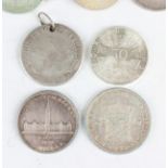 A collection of foreign coins, including an Austria fifty schillings 1974, a Prussia thaler 1786 (