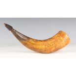 An early 19th century Continental engraved cow horn powder flask, the body decorated overall with