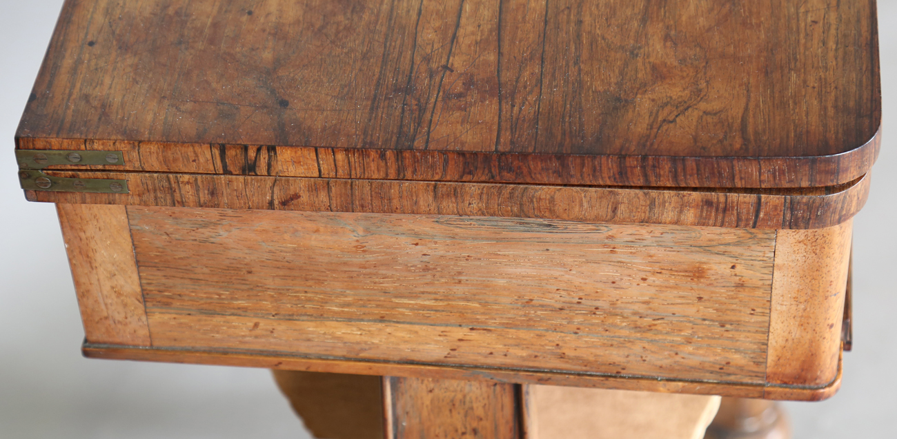 A Victorian rosewood work table, the top hinged to reveal a surface inset with leather above a - Image 10 of 11