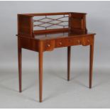 An early 20th century American mahogany and boxwood inlaid lady's writing table, the glazed