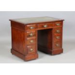An Edwardian walnut twin pedestal desk of small proportions, height 73cm, width 92cm, depth 59cm.