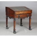 A Regency mahogany gentleman's writing desk, in the manner of Thomas Hope, the hinged writing