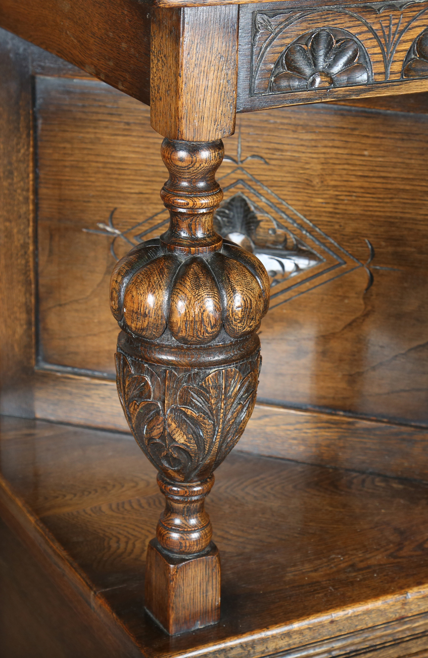 A 20th century Jacobean Revival oak court cupboard, height 134cm, width 122cm, depth 48cm.Buyer’s - Image 2 of 12