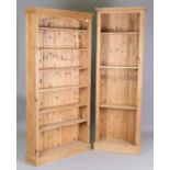A modern pine double-section open bookcase, height 219cm, width 154cm, depth 31cm, together with