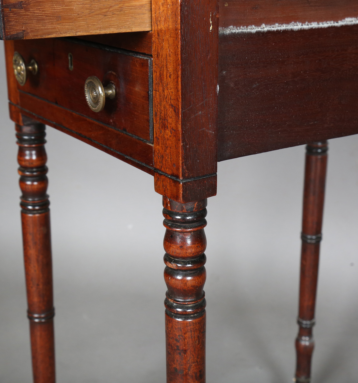 A Regency mahogany work table, fitted with two fall flaps and drawers, on ring turned legs and - Image 4 of 7