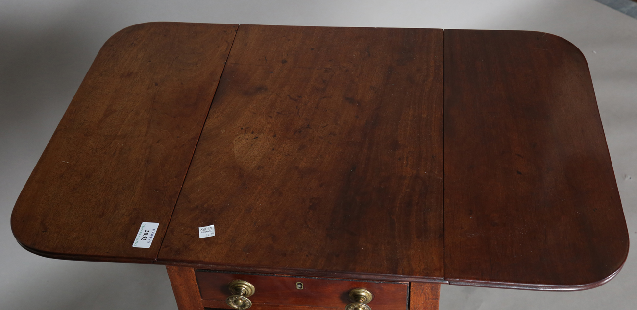 A Regency mahogany work table, fitted with two fall flaps and drawers, on ring turned legs and - Image 2 of 7