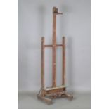 An early 20th century oak framed artist's easel, formerly owned and used by Sir Frank Brangwyn RA,