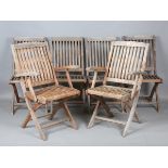 A set of six late 20th century teak folding garden chairs, comprising two armchairs height 96cm,