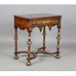 An early 20th century William and Mary style walnut side table, the crossbanded top above an oak-