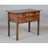 A George III mahogany lowboy, the moulded top above three drawers, height 72cm, width 86cm, depth