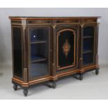 A late Victorian ebonized and foliate inlaid credenza, the front with projecting column supports and