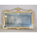 A late 20th century Neoclassical style gilt framed wall mirror, height 69cm, width 93cm.Buyer’s