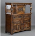 A 20th century Jacobean Revival oak court cupboard, height 134cm, width 122cm, depth 48cm.Buyer’s