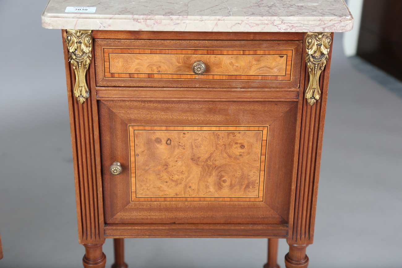 A pair of early 20th century French marble-topped bedside cabinets with ormolu mounts and ceramic- - Image 3 of 15