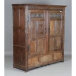 A 17th century and later oak panelled cupboard, height 174cm, width 165cm, depth 56cm (