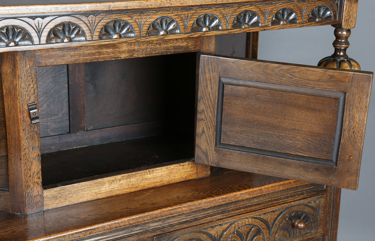 A 20th century Jacobean Revival oak court cupboard, height 134cm, width 122cm, depth 48cm.Buyer’s - Image 6 of 12