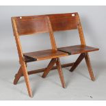 An early 20th century stained ash twin-seated folding bench, height 80cm, width 96cm.Buyer’s Premium