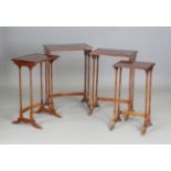 An early 20th century mahogany quartetto nest of occasional tables with chequer banded tops and