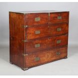 An early 19th century teak and brass bound campaign military chest, the five drawers with recessed