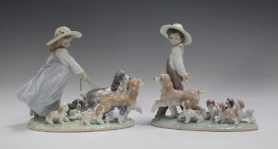 Two Lladro figure groups, comprising My Little Explorers, No. 6828, length 25.5cm, and Puppy Parade,