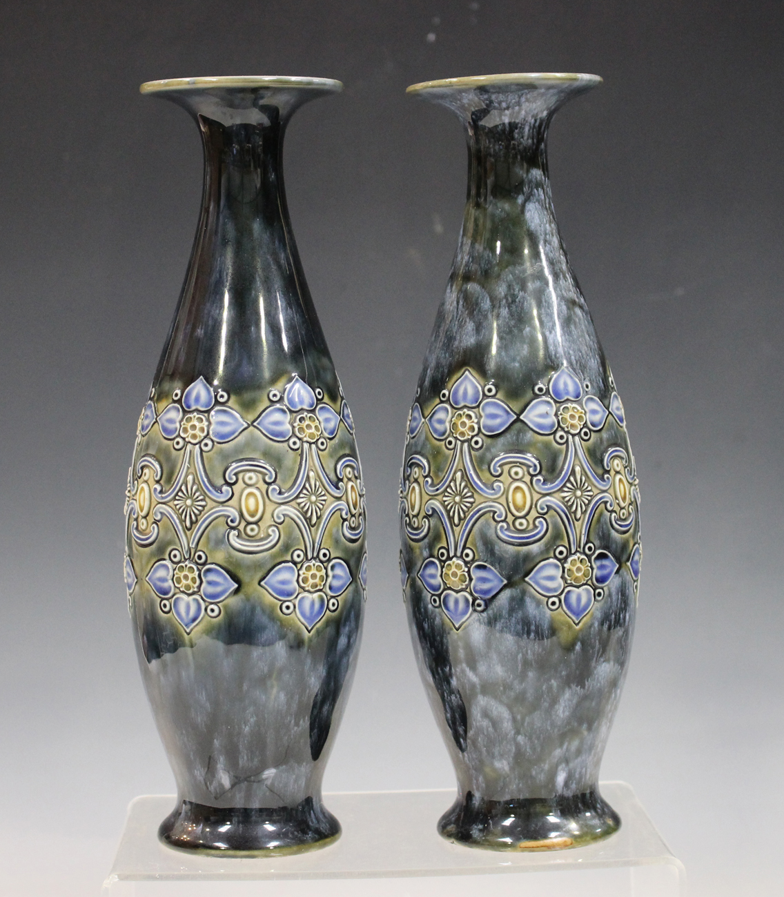 A pair of Royal Doulton stoneware vases, early 20th century, the mottled green/blue glazed bodies